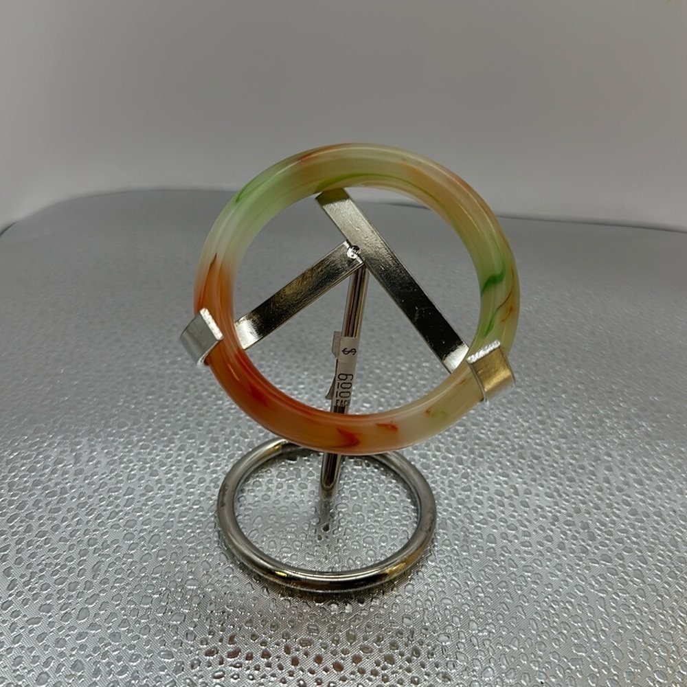 Jade bracelet the jaded self is 1 inch. The opening is 3 inches.​​​